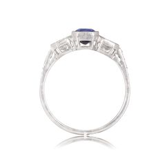 an art deco style ring with blue sapphire and diamonds