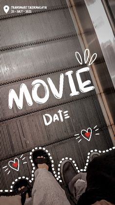 someone standing on an escalator with the words movie date written in white letters