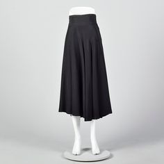 "This listing is for one skirt. Textile is unmarked. Full skirt with pleated waistband. This is a very lovely black skirt with a nice sweep. Beautiful drape and movement. Wide waistband with horizontal pleats. Left side zip with button and loop closures at the waistband. Size Marked: Unmarked Approximate Size: Medium **Please Check Measurements to be Sure! Fabric: Unmarked Lining Type: None Closure: Zip Label: Unmarked Condition: Excellent Era: 1950s Inventory#: DSC1018-1984 Measurements- Waist: Black Drapes, Vintage Rock, Beautiful Drapes, Womens Skirts, 1950s Vintage, Wide Waistband, Black Skirt, Full Skirt, Vintage Skirt