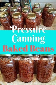 jars filled with baked beans sitting on top of a counter next to a blue sign that says pressure camping baked beans