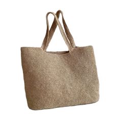 This is a beige beach bag with a robust and unique design. Notable for its sturdy construction, this bag is 100% handmade and crafted with raffia yarn, resulting in an excellent knit. The bag's spacious interior allows you to easily carry all your beach essentials. Its durable material makes it perfect for long-term use. Both stylish and functional, this bag is an ideal accessory to complement your look at the beach. Raffia Lightweight Beige Rectangular Beach Bag, Eco-friendly Neutral Shoulder Bag For Beach, Eco-friendly Lightweight Beige Shoulder Bag, Neutral Crochet Tote Bag For Vacation, Lightweight Beige Crochet Bag Rectangular, Beige Jute Bags For Beach Season, Rectangular Neutral Shoulder Bag For Beach, Neutral Rectangular Shoulder Bag For Beach, Beige Lightweight Crochet Bag For Beach Season