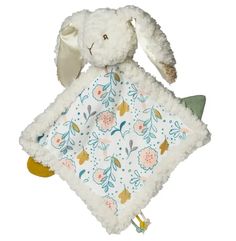 a stuffed animal with a blanket on it's back, sitting in front of a white background