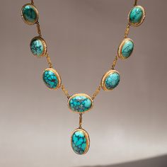 Antique Turquoise Gemstone Jewelry, Luxury Turquoise Cabochon Jewelry, Antique Turquoise Cabochon Jewelry, Luxury Turquoise Necklace With Cabochon, Handmade Elegant Turquoise Necklace, Luxury Turquoise Oval Necklace, Elegant Turquoise Natural Stone Beads, Turquoise Cabochon Necklace For Formal Occasions, Artisan Turquoise Jewelry For Formal Occasions