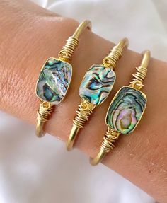 **Each piece in my shop, I personally create and photograph. (All photos are property of The Cord Gallery LLC) Thank you for supporting my small business. Genuine Abalone Shell Cuff Bracelet - Beachy Jewelry Add some color to your collection with these vibrant bracelets!  Features genuine Abalone Shells, framed in 22k gold plating and affixed to a raw brass cuff.  Each shell has stunning iridescent shades of blue, green, pink, and gold and will be totally unique as these are taken from nature to Luxury Oyster Bracelet Cuff As Gift, Luxury Abalone Shell Jewelry Gift, Elegant Handmade Bracelets For Vacation, Bohemian Stackable Cuff Bracelet As Gift, Bohemian Stackable Cuff Bracelet Gift, Elegant Stackable Beach Jewelry, Adjustable Oyster Bracelet Bangle As A Gift, Adjustable Abalone Shell Jewelry Gift, Adjustable Abalone Shell Jewelry For Gifts