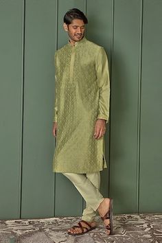 Olive green chanderi kurta with all over floral jaal pattern and tonal resham embroidery. Paired with contrast pyjama. - Aza Fashions Green Cotton Silk Sherwani With Zari Work, Green Chanderi Bandhgala With Cutdana, Traditional Green Silk Sherwani, Green Chanderi Bandhgala With Traditional Drape, Green Chanderi Sherwani With Traditional Drape, Green Chanderi Bandhgala With Zari Work, Green Chanderi Bandhgala With Dabka Work, Green Chanderi Bandhgala With Dabka Details, Green Dabka Chanderi Bandhgala