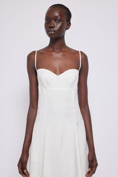 a model in a white dress