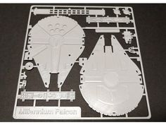 a plastic model of the millennium falcon from star wars is shown on a black surface