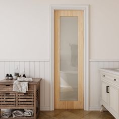 a bathroom with a sink, mirror and wooden cabinet next to the bathtub in it