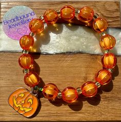 🕷️NEW FOR HALLOWEEN🎃 ✨PRODUCT DESCRIPTION The Pumpkin beaded bracelet from Beadbound Jewellery is a pretty orange bracelet accessory that is perfect for Halloween 🎃. Made by hand, the bracelet is made with alternating faceted acrylic orange beads and gold seed beads. It is finished with a spooky pumpkin enamel charm for added decoration. Please select your bracelet size when ordering. ✨PRODUCT CARE The beads are threaded onto elastic string so the bracelet will stretch to fit your wrist, but Pumpkin Bead, Pretty Orange, Orange Bracelet, Spooky Pumpkin, Enamel Charms, Bracelet Sizes, Accessories Bracelets, Favorite Things Gift, Wedding Shop