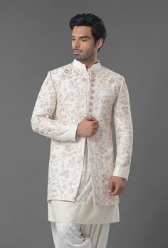 Ivory Color Embroidered Sherwani Off White Bandhgala With Naqshi For Festive Occasions, Off White Naqshi Bandhgala For Festive Occasions, Off White Dabka Kurta For Reception, Festive Off White Bandhgala With Naqshi, Cream Churidar For Diwali Reception, Gold Bandhgala With Chikankari Embroidery For Diwali, Cream Long Sleeve Sherwani For Transitional Season, Cream Salwar Kameez For Reception, Cream Salwar Kameez For Reception In Transitional Season