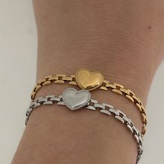 "Heart Link Bracelet ✨💕 18k gold plated stainless steel & silver stainless steel watch band chain bracelet  Made with a unique puffed gold heart charm Length can be adjusted with the extender!  6\" with extender and lobster clasp closure 😊" Stainless Steel Heart Bracelets For Everyday, Everyday Stainless Steel Heart Bracelet With Charm, Metal Heart Bracelet With Chain For Gift, Everyday Tarnish Resistant Heart Bracelet, Trendy Gold Heart Bracelet With Chain, Gold Stainless Steel Heart Bracelet As Gift, Everyday Heart Shaped Tarnish Resistant Bracelet, Everyday Stainless Steel Heart Bracelet, Tarnish Resistant Heart Chain Bracelet