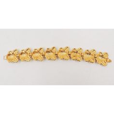 This is part of Chairish’s Costume Jewelry assortment.  1980s goldtone & clear rhinestone link bracelet with fold over clasp. Marked "Bijoux Cascio." The rhinestones are very sparkly and may be Swarovski. Measures: 7 1/2 inches long by 1 inch wide. Excellent condition.    Please reference the measurements noted in the description above for the best approximate dimensions. Please reach out to the seller under "Ask the Seller" for specific questions regarding the measurements. Gold Metal Jewelry With Butterfly Clasp, Gold-tone Costume Jewelry Bracelet, Vintage Gold-plated Yellow Gold Bracelet, Vintage Gold Crystal Bracelet With Rhinestones, Vintage Gold Jewelry With Butterfly Clasp, Vintage Yellow Gold-plated Bracelet, Vintage Tarnish-resistant Yellow Gold Bracelet, Rhinestone Bracelet, Fold Over