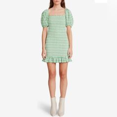 Explore Your Day With A Chic And An Elegant Look Wearing The Bb Dakota X Steve Madden Picnic Vibes Dress. Mini Length Dress With Allover Cute Gingham Pattern. Square Neckline And Short Puff Sleeves. Smocked Pattern Throughout. Ruffled Detailing On The Hem. Pull-On Construction. 80% Polyester, 20% Rayon. Hand Wash, Dry Flat Or Dry-Clean. Green Mini Dress With Ruffle Hem, Flirty Fitted Mini Dress For Picnic, Flirty Summer Mini Dress For Picnic, Flirty Mini Dress For Summer Picnic, Fitted Flirty Mini Dress For Picnic, Casual Summer Mini Dress For Picnic, Green Summer Mini Dress For Picnic, Green Mini Dress For Picnic, Green Mini Dress With Ruffle Hem And Square Neck