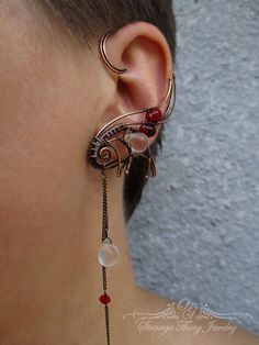 A pair of ear cuffs made of copper wire, chains and glass Czech beads. These ear wraps are worn behing your ear like a Blue Tooth device and no piercing is needed.  They are easy to adjust to the size of ear more perfectly by just slowly pulling down (or squeezing) the lower part of the ear cuff, this pair is adjustable for ear sized 2.1 - 2.7 inches (5.3 - 6.6 cm) . For ear cuff of smaler or bigger size convo me, Ill be happy to make a pair specially for you. the ear cuffs come in a gift box... Unique Adjustable Pierced Ear Climbers, Adjustable Unique Style Ear Climbers, Unique Handmade Metal Ear Cuff, Pierced Metal Ear Cuff With Unique Style, Unique Handmade Metal Ear Climbers, Unique Adjustable Pierced Ear Cuff, Handmade Adjustable Ear Climbers, Unique Party Ear Cuff Wire Wrapped, Handmade Wire Wrapped Ear Cuff For Party