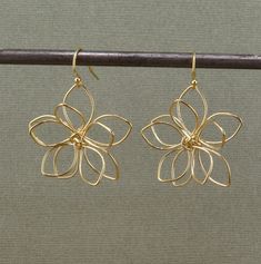 Gold Wire Wrapped Flowers on gold filled ear wires - Gold plated brass flowers - Flowers measure 32mm   - Gold Filled Wires - Lightweight and Comfortable Here is the link to the identical earrings in silver instead of bronze: https://mosaicsunstudio.etsy.com/listing/1648730710 Wire Wrapped Flower Earrings, Cute Wire Earrings, Butterfly Wire Earrings, Brass Flower Charm Earrings, Delicate Gold Flower Charm Earrings, Gold Brass Flower Earrings, Delicate Gold Flower Earrings With Charm, Gold Delicate Flower Earrings, Delicate Gold Flower Earrings