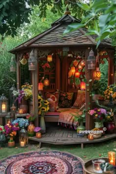 an outdoor gazebo with flowers and lanterns