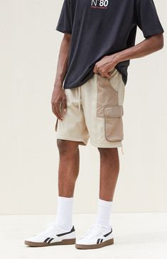 Introducing the Tan Baggy Nylon Cargo Zip Off Pants from PacSun, combining functionality with versatility for your everyday adventures. With a drawstring waistline and side pockets for added convenience, these pants offer comfort and practicality. Featuring a unique zip-off to shorts feature and cargo pockets with a clap, they provide multiple styling options. Finished with a straight leg silhouette, they're the perfect choice for effortless streetwear-inspired looks. Zip Off Pants, Everyday Adventures, Pacsun, Straight Leg, Street Wear, Pants, Trousers