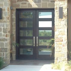 the front entrance to a home with glass doors