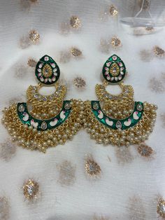 These beautiful hand painted earrings perfect for any event available in 3 colours.  No returns and no refunds. Care instructions: Please keep away from perfume, water and harsh chemicals. To clean please just wipe with a clean dry fibre cloth. Hand Painted Earrings For Party, Handmade Green Bridal Earrings For Festive Occasions, Green Earrings As Diwali Gift, Green Drop Earrings For Festivals, Green Handmade Chandelier Earrings For Festive Occasions, Handmade Enamel Earrings For Party, Green Meenakari Chandbalis For Celebration, Handmade Green Earrings For Diwali, Green Chandelier Earrings For Diwali Gift