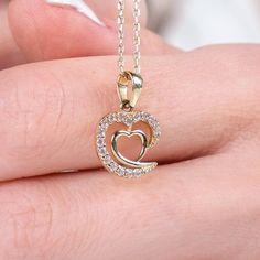 ✥ Celebrate a milestone with our Intertwined Hearts Diamond Necklace, an ideal anniversary gift. This exquisite necklace features two hearts intricately intertwined, symbolizing the deep connection and enduring love between two people. Adorned with sparkling diamonds, it adds brilliance and elegance to any ensemble. Crafted from high-quality materials for lasting beauty and durability, it's perfect for daily wear or special occasions. A heartfelt expression of love and commitment, this necklace Intertwined Hearts, Charles And Colvard Moissanite, Heart Necklace Diamond, Expression Of Love, Enduring Love, Deep Connection, Jewelry Images, Rose Gold Metal, Two Hearts