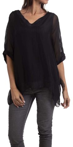 Gentle flowing pure silk, double V-neck silk blouse. Short sleeve finished with wide double-layer hem. Exterior 100% Silk | Interior 95% Viscose, 5% Elastic Model 5'8" One Size Made in Italy Black V-neck Rayon Blouse, Sheer V-neck Blouse For Work, Flowy V-neck Viscose Blouse, Solid Color Flowy V-neck Blouse, Flowy Solid Color V-neck Blouse, Flowy Solid V-neck Blouse, Flowy V-neck Blouse, Solid V-neck Blouse For Layering, Elegant Silk V-neck Tunic