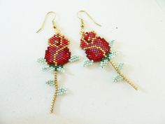 red rose beaded earrings on white background