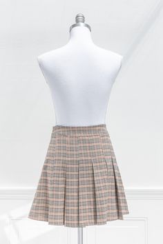 Inspired by vintage academia, the Elisa mini skirt features a pleated hem, brown plaid print, and a short length. Perfect with tights, a cardigan, and beret for a french-inspired collegiate look! . Details: S: Waist 28", Length 16" M: Waist 30", Length 16.5" L: Waist 32", Length 17" Unlined 97% Polyester, 3% Spandex Hand Wash Cold / Hang Dry Imported Ships in 1 to 2 Business Days Free US Shipping on Orders over $100 Pleated Short Skirt, Vintage Academia, Skirt Collection, French Girl Style, Plaid Mini Skirt, Brown Plaid, French Inspired, Halloween Dress, Plaid Print