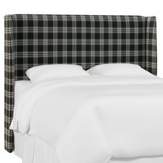 a black and white plaid headboard on a bed