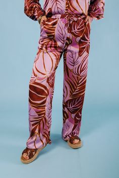 Add some playful flair to your wardrobe with The Tropical Satin Pants. Featuring a vibrant tropical print, these satin pants boast a stylish wide leg cut, perfect for any warm weather occasion. Stand out and make a statement in these quirky and fun pants that are sure to turn heads. Fabric Content: 100% POLYESTER Fun Pants, Satin Pants, Tropical Print, Warm Weather, Lilac, Wide Leg, Satin, Turn Ons, Wardrobe