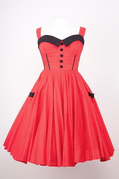 Exclusive to Doghouse Vintage this full circle Rock and Roll dress is vibrant red with white dots, black trim to bust line,ric rac braid in black runs down the front bodice, Back zip and Elasticated panels at the side, Pretty details on front, covered buttons in black and a half waist belt,ties at the back Adjustable strap length, Quality cotton used throughout. Fitted Polka Dot Dress For Costume Party, Retro Red Dress For Costume Party, Red Rockabilly Summer Dress, Red Sleeveless Rockabilly Dress, Rock And Roll Dress, Rock And Roll Dresses, Roll Dress, Rock And, Circle Dress