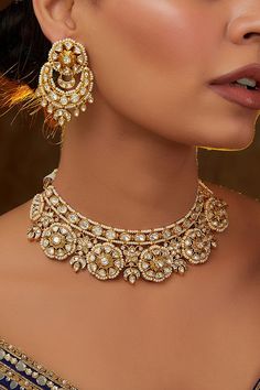 Gold necklace set, Polki necklace set, pearl embellished necklace set, best kundan jewelry, Jewelry designs, aesthetic Jewelry Dulhan SetZevar by Geeta designs this shimmery necklace rendered in gold-plated mixed metal encrusted with pearl, kundan and polki embellishments, complementing it with matching earrings. Style them with a brocade sari set and block heels for a wedding reception. Kundan Jewellery Set Necklaces, Dulhan Set, Heels For A Wedding, Uncut Jewellery, Kundan Polki Necklace, Polki Necklace Set, Designs Aesthetic, Kundan Jewellery Set, Gold Necklace Indian