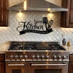 a stainless steel stove top oven sitting inside of a kitchen