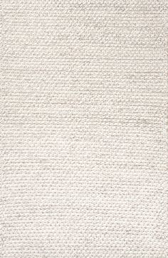 a white rug with small squares on the bottom and one line in the middle, which is