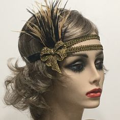 This stunning 1920's Downton Abbey vintage inspired Art Deco flapper headband is the perfect accompaniment for any styled event. I've designed and created this of a kind headband so feminine and romantic. Made with two rows of a black and gold woven trim backed with satin elastic. This headpiece features black and antique gold Ostrich feathers embellished with a Vintage Inspired Antique Brass Bow brooch with Gold Rhinestones.  I have designed and created each piece from my smoke-free studio. All pieces are securely wrapped and boxed to prevent damage/breakage. Ready to ship.  Feel free to convo me if you have any questions. Thank you very much for visiting my shop. Have a blooming day! Vintage Adjustable Fascinator Headband, Flapper Style Fascinator Headband For Party, Gold Headband Headpieces For Carnival, Vintage Headband Costume Hat For Party, Vintage Costume Headband For Party, Vintage Adjustable Costume Hats And Headpieces For Party, Vintage Adjustable Costume Hat For Costume Party, Vintage Adjustable Costume Accessories For Costume Party, Elegant Carnival Headband Headpiece