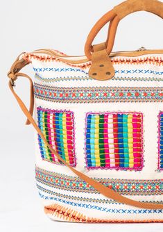 Travel in style with this ultra-bohemian weekender travel bag. A colorful statement piece featuring embroidered details, a zip-top closure, and suede trim. The large carry-all size is perfect for last-minute getaways. Embroidered Stitch details Zip-top closure Suede leather top handles Leather shoulder strap Bohemian weekender bag Dimensions: 24" X 17 3/4"Style: DR-8474 Travel Multicolor Embroidered Hobo Tote Bag, Multicolor Travel Bag With Zipper For Weekend Trips, Bohemian Satchel Duffle Bag For Trips, Bohemian Duffle Bag With Leather Handles For Daily Use, Bohemian Canvas Satchel Bag, Travel-ready Multicolor Embroidered Hobo Shoulder Bag, Multicolor Weekender Bag With Zipper For Daily Use, Travel Hobo Bag With Multicolor Embroidery, Multicolor Rectangular Weekender Bag With Zipper