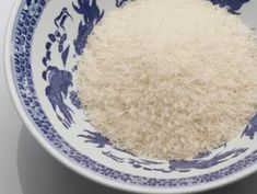 white rice in a blue and white bowl