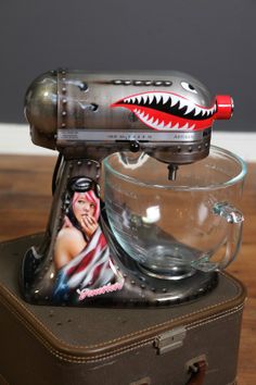 an old fashioned mixer with a shark head on it