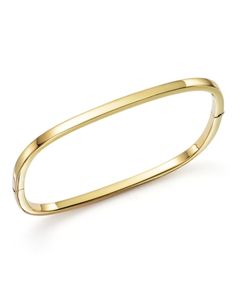 A classic bangle with a modern shape in 18K yellow gold. Modern Yellow Gold Cuff Bracelet With Shiny Finish, Modern Yellow Gold Polished Cuff Bracelet, Modern Shiny Yellow Gold Cuff Bracelet, 14k Gold Bangle With Shiny Finish, Modern Yellow Gold Bangle With Polished Finish, Modern Gold Bangle With Polished Finish, Elegant Yellow Gold Cuff Bracelet For Formal Occasions, Yellow Gold Shiny Finish Cuff Bracelet, Modern Yellow Gold Bracelet With Shiny Finish