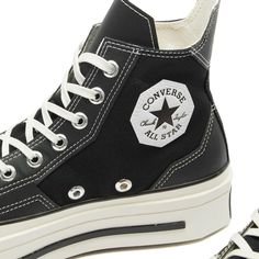 Embrace a fusion of classic and contemporary design with the Converse Chuck 70 De Luxe Squared Sneakers. These sneakers, with their sturdy canvas uppers and faux leather overlays, offer a geometric aesthetic that's both striking and stylish. The angular details, combined with a robust rubber midsole and OrthoLite cushioning, ensure optimal comfort..Canvas Uppers.Faux Leather Overlays.Rubber Midsole.OrthoLite Cushioning.Silver-Toned Eyelets.Brand Patches.Shop All Converse Sneakers Custom Textile Sneakers With Contrast Sole For Streetwear, Custom Canvas Sneakers With Contrast Sole For Streetwear, Black Canvas Converse Platform Sneakers, Converse Retro Sneakers With Contrast Sole, Retro Converse Sneakers With Contrast Sole, Canvas Platform Sneakers With Contrast Sole For Streetwear, Black Canvas Platform Sneakers With Rubber Sole, Retro Leather Custom Sneakers For Streetwear, Black Mid-top Canvas Platform Sneakers