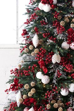 a christmas tree with red and white ornaments