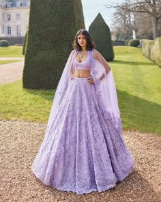 This lehenga set features intricate tonal sequin, beads and crystal embroidery. The blouse has a plunging neckline and comes with four sided embroidered net dupatta with long beaded tassels.From Seema Gujral's Love Notes From Paris Collection DELIVERY TIMEPlease allow 8-12 weeks for your outfit to arrive. FABRIC DETAILSNet Professional cleaning only. Purple Pastel Lehenga, Punjabi Bride Wedding Outfits, Indian Sweet Sixteen Dresses, Lengha Dress Gowns, Lilac Wedding Lehenga, Light Purple Dupatta, Lilac Sharara Suit, Lavender Indian Wedding Dress, Lavender Bridal Lengha