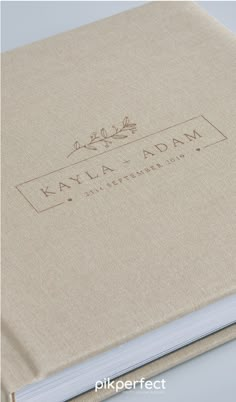 an open book with the words kayla rama written in gold on it's cover