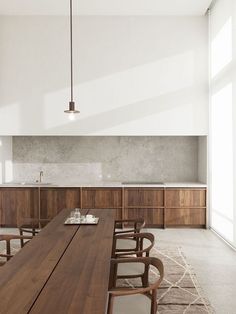 a large wooden table sitting in the middle of a room