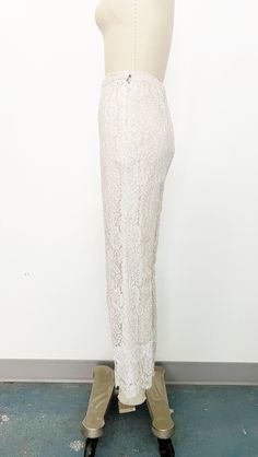 Mod 1960s handmade lace pant set - Skinny strap white lace tunic with sweetheart neckline and scalloped hem. Metal zipper on the back with hook-and-eye closure at top. Fully lined with blush fabric and nude overlay. - Cropped straight leg high-rise white lace pants with scalloped hem. Side metal zipper and hook-and-eye closure on tab. Fully lined in blush fabric with nude overlay. Label: Fashioned by Ruth Steele Fitted Party Bottoms With Delicate Lace, Elegant Lace Bottoms With Lace Trim, Fitted Bottoms With Scalloped Edges For Spring, Feminine Scalloped Lace Bottoms, Fitted Beige Lace Bottoms, Chic Fitted Bottoms With Delicate Lace, Elegant Beige Bottoms With Lace Trim, Chic Fitted Bottoms With Lace Patchwork, Chic Beige Bottoms For Wedding