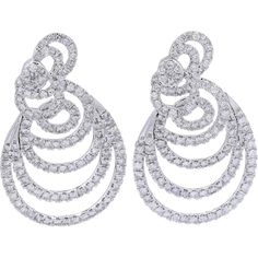 Embrace the elegance of timeless sophistication with the 14K White Gold 7 Carat Total Weight Diamond Spiral Statement Earrings.Crafted to capture attention and ignite admiration, these earrings exude opulence and grace. Each dazzling diamond, totaling an impressive 7 carats, is meticulously set within a captivating spiral design, creating an aura of luxury and allure. The brilliance of the diamonds is further enhanced by the luminosity of the 14K white gold, adding a touch of glamour to any ensemble.These statement earrings are more than just accessories; they are symbols of refined taste and unmatched beauty. Whether worn for a special occasion or to elevate everyday glamour, they effortlessly exude confidence and sophistication. Let these exquisite earrings be a testament to your impecca Luxury White Gold Diamond Chandelier Earrings, Luxury Art Deco White Gold Diamond Earrings, Formal Spiral Jewelry With Matching Earrings, Formal Spiral-shaped Jewelry With Matching Earrings, Elegant White Gold Spiral Earrings, Classic Spiral Jewelry For Formal Occasions, Elegant Spiral Jewelry For Formal Occasions, Elegant Swirl Earrings, White Gold Spiral Jewelry For Formal Occasions