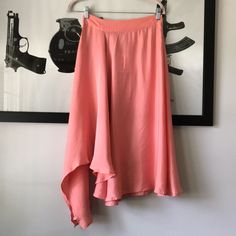 Suncoo Fleur Midi Skirt In Rose....Size T1 Or S. Ruffled Asymmetric Midi Skit Ruffled Midi Skirt, Asymmetric On The Side, Fluid Fabric In Cupro And Lyocell, Zippered Closing On The Side, Waistband. Flowing Slinky Matte Satin; 60% Cupro, 40% Lyocell. Waist Across 13.25". Length 23" At Shortest And 36" At Longest. New With Tag. C Asymmetrical Wrap Skirt For Summer Party, Summer Party Asymmetrical Wrap Skirt, Pink Asymmetrical Hem Skirt For Spring, Summer Party Draped Skirt With Asymmetrical Hem, Asymmetrical Wrap Skirt For Brunch, Asymmetrical Wrap Skirt With Lining For Brunch, Asymmetrical Lined Wrap Skirt For Brunch, Pink Party Bottoms With Asymmetrical Hem, Pink Asymmetrical Summer Skirt