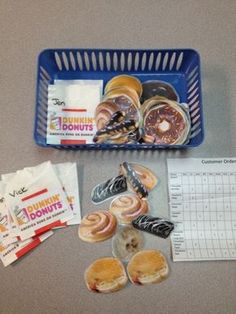 donuts are sitting on the counter next to a basket