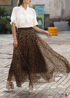 Leopard print long, light and flowy bohemian skirt Leopard print is back this season with this light, vaporous, and unique boho skirt for a wild and beautiful style. This flowing bohemian maxi skirt perfectly changes from style depending on what you're searching for: rock'n roll when paired with a leather jacket, boho chic when paired with an embroidered top: this flowy boho maxi skirt wonderfully changes from style depending on what you're looking for. We prefer to add a few accessories to our Bohemian Full-length Maxi Skirt For Spring, Brown Bohemian Long Skirt, Bohemian Non-stretch Maxi Skirt For Day Out, Bohemian Flowy Full-length Maxi Skirt, Bohemian Non-stretch Maxi Skirt, Boho Maxi Skirt, Bohemian Maxi Skirt, Maxi Skirt Boho, Boho Skirt