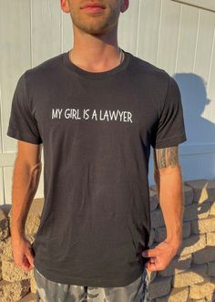 a man wearing a t - shirt that says, my girl is a lawer