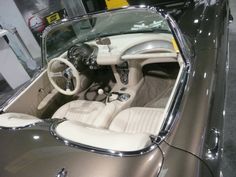 the interior of a sports car is clean and ready for customers to ride in it